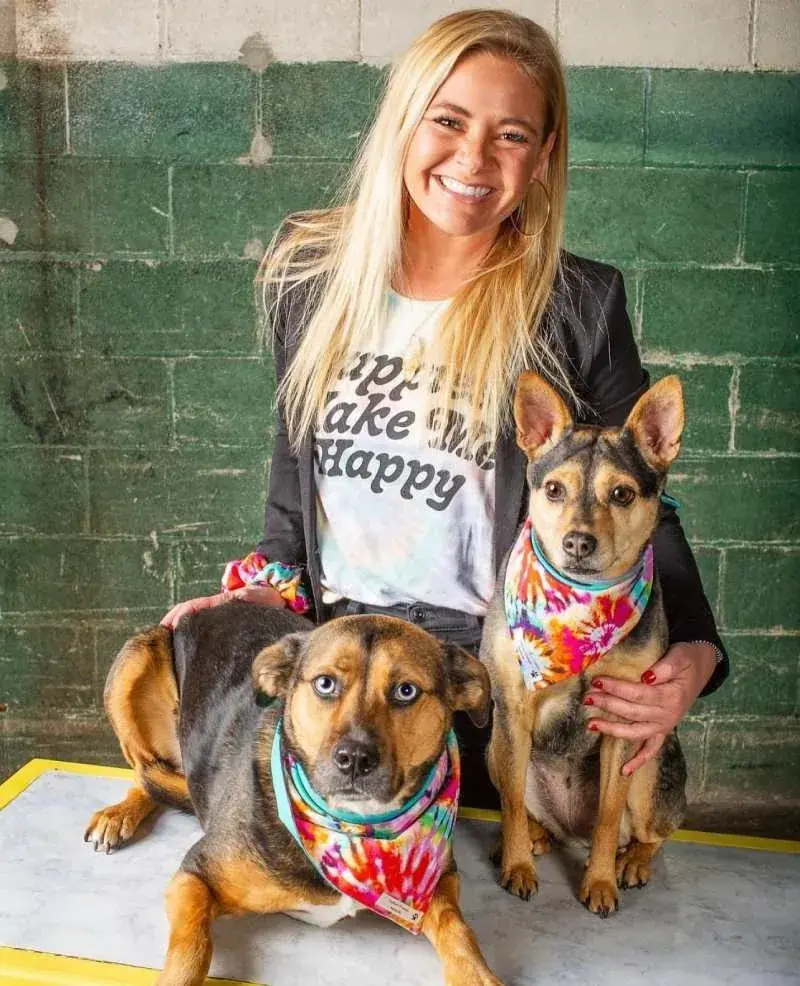 Owner Abby Walters showing off her handmade bandanas on her dogs