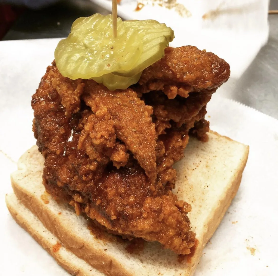 Prince's Nashville hot chicken on white bread with pickles