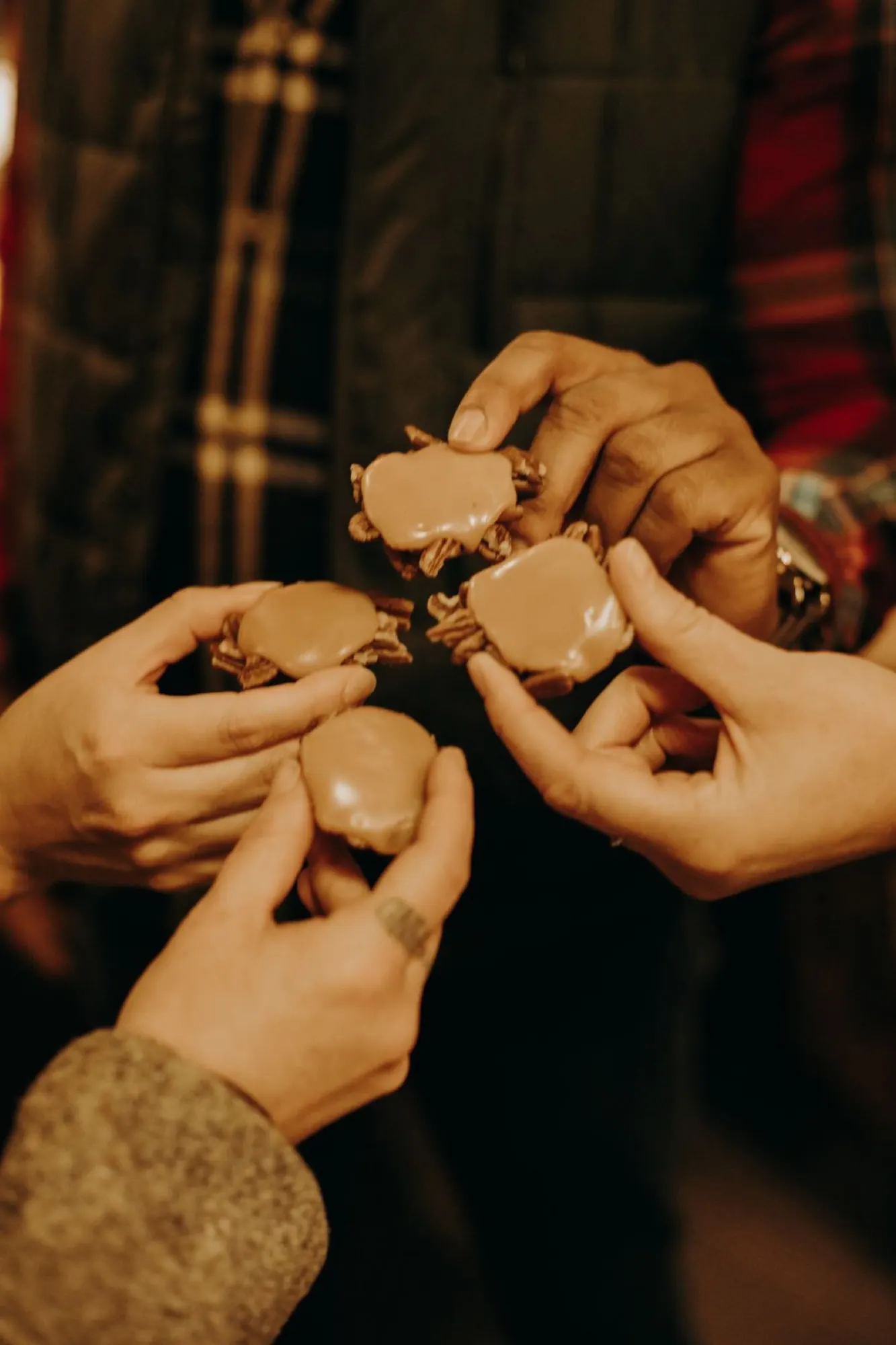 Guests sharing hand-made pecan pralines from Leon's Candy