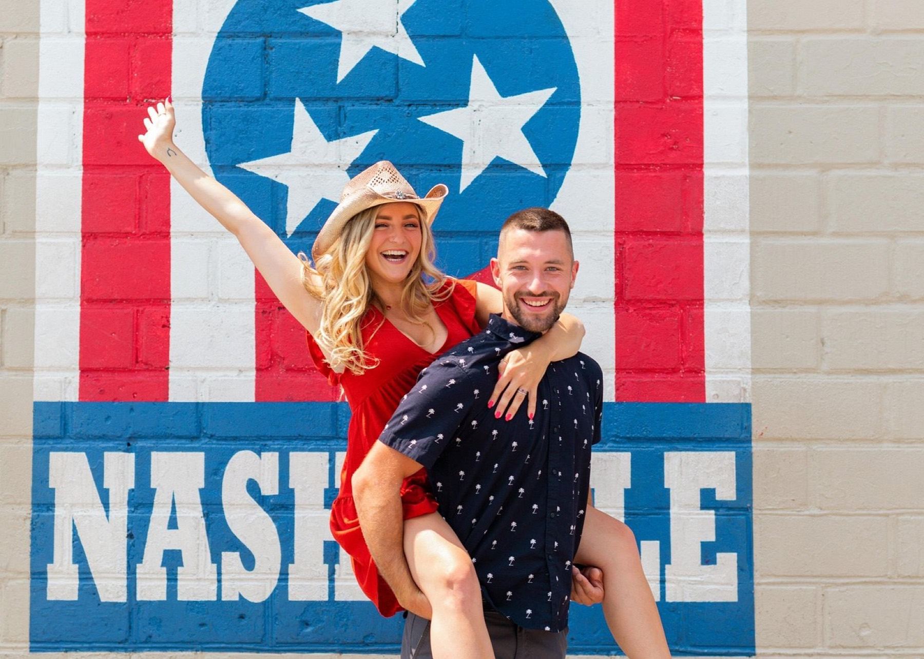 Guests photographing a colorful Nashville mural