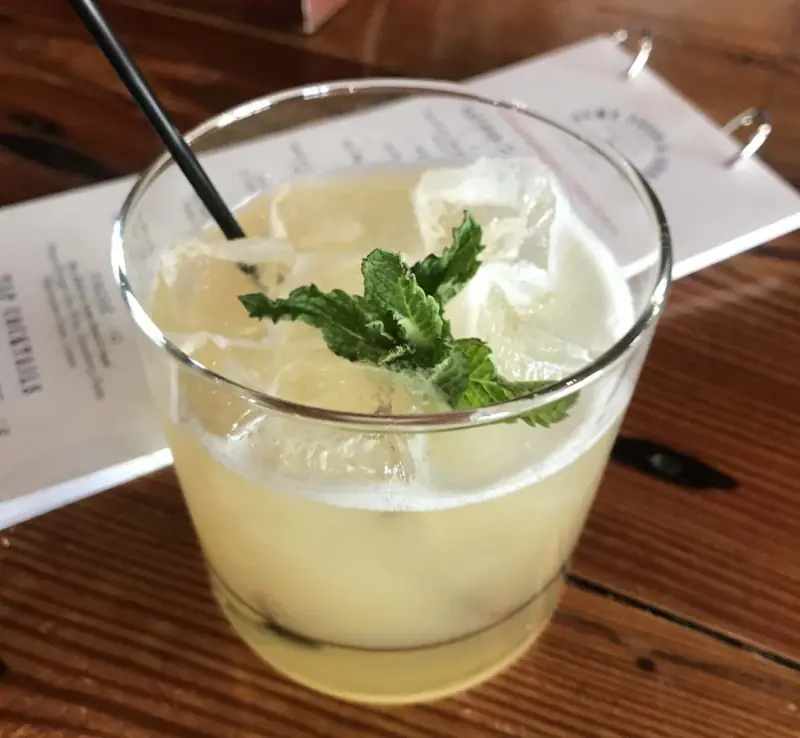 A cocktail strained into a coupe glass
